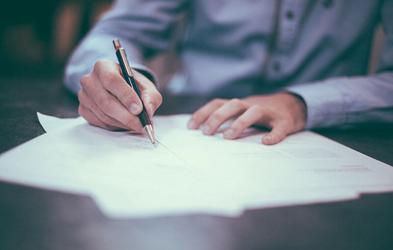 a person signs documents